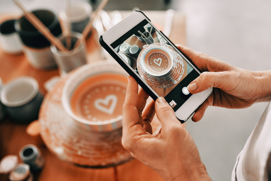 business owner taking a picture of a product for a social media business page